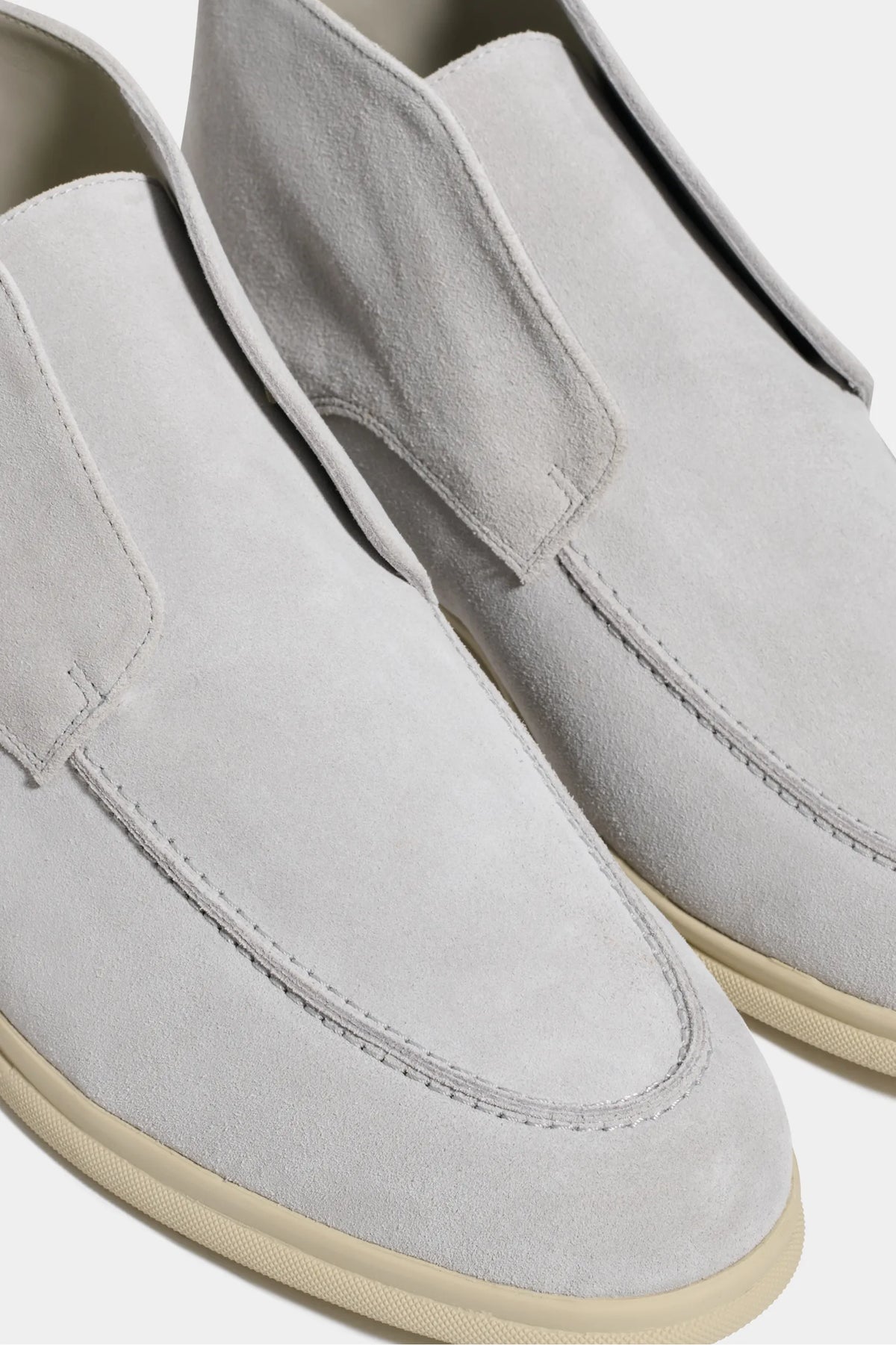 light grey polacchino, men suede polacchino, italian suede loafers, light grey suede loafers, slip-on suede boot, mid-top suede shoe, made in italy polacchino, luxury suede polacchino, elegant suede footwear, refined italian polacchino, premium suede loafers, soft suede ankle boot, versatile suede shoe, handcrafted italian footwear, timeless polacchino design, comfortable suede loafers, upscale suede shoe, italian craftsmanship polacchino, casual luxury footwear, classic light grey suede loafer