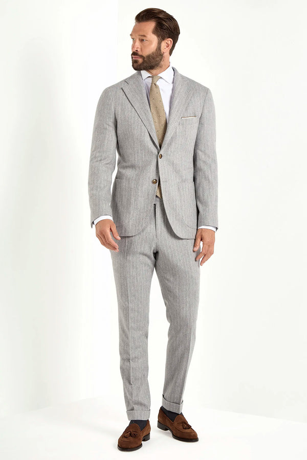 Light grey striped suit, Italian style, made in Italy, tailored luxury suit, elegant menswear suit, refined formalwear, premium Italian craftsmanship, classic striped suit, sophisticated business suit, smart formal attire, versatile modern suit, polished two-piece suit, fine Italian tailoring, upscale menswear suit, timeless Italian suit, refined professional look, sharp tailored suit, luxury office suit, contemporary striped blazer, Italian elegance suit