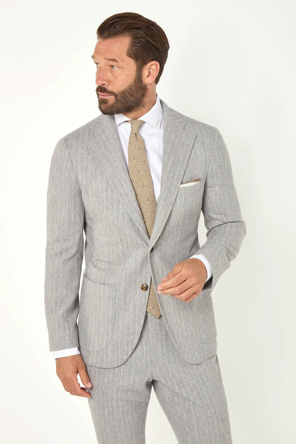 Light grey striped suit, Italian style, made in Italy, tailored luxury suit, elegant menswear suit, refined formalwear, premium Italian craftsmanship, classic striped suit, sophisticated business suit, smart formal attire, versatile modern suit, polished two-piece suit, fine Italian tailoring, upscale menswear suit, timeless Italian suit, refined professional look, sharp tailored suit, luxury office suit, contemporary striped blazer, Italian elegance suit