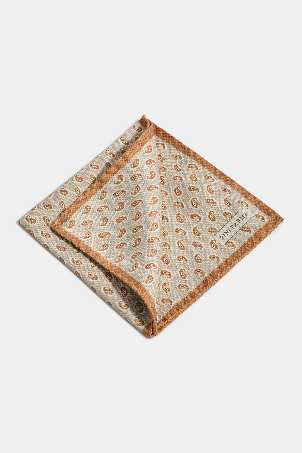 Paisley patterned pocket square with brand name on a white background