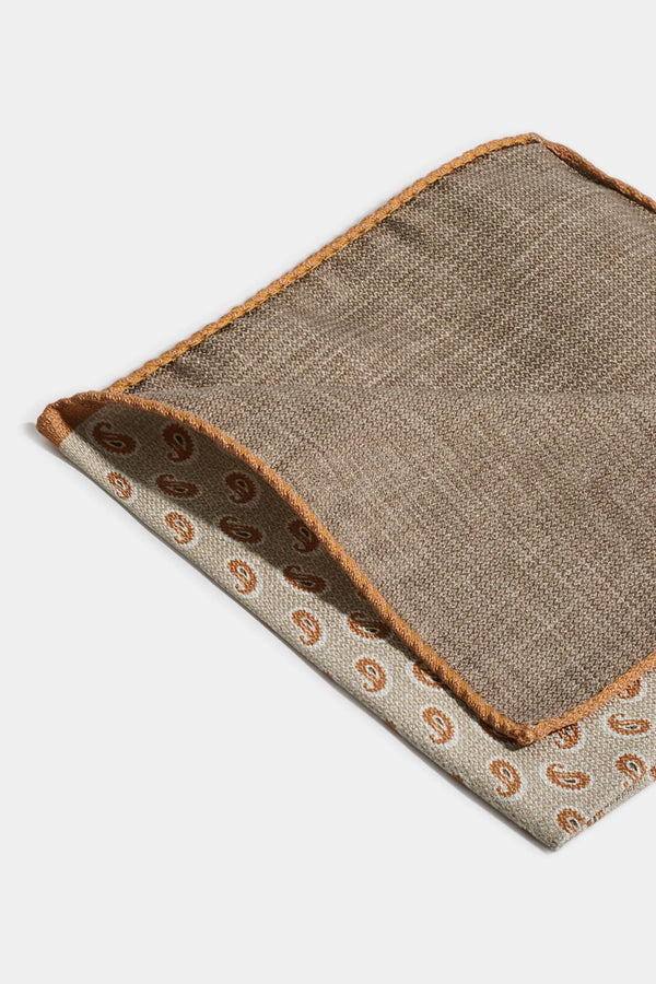 Textured fabric with paisley pattern on a white background