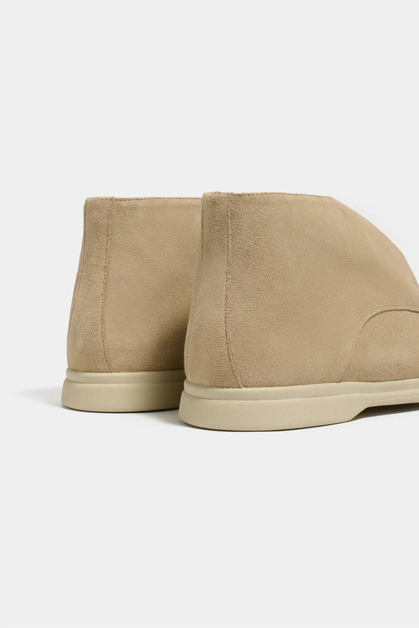 beige polacchino, men suede polacchino, italian suede loafers, beige suede loafers, slip-on suede boot, mid-top suede shoe, made in italy polacchino, luxury suede polacchino, elegant suede footwear, refined italian polacchino, premium suede loafers, soft suede ankle boot, versatile suede shoe, handcrafted italian footwear, timeless polacchino design, comfortable suede loafers, upscale suede shoe, italian craftsmanship polacchino, casual luxury footwear, classic beige suede loafer