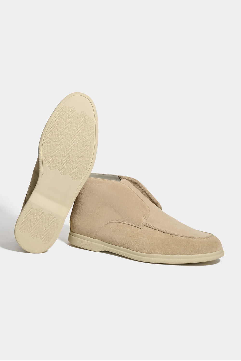beige polacchino, men suede polacchino, italian suede loafers, beige suede loafers, slip-on suede boot, mid-top suede shoe, made in italy polacchino, luxury suede polacchino, elegant suede footwear, refined italian polacchino, premium suede loafers, soft suede ankle boot, versatile suede shoe, handcrafted italian footwear, timeless polacchino design, comfortable suede loafers, upscale suede shoe, italian craftsmanship polacchino, casual luxury footwear, classic beige suede loafer