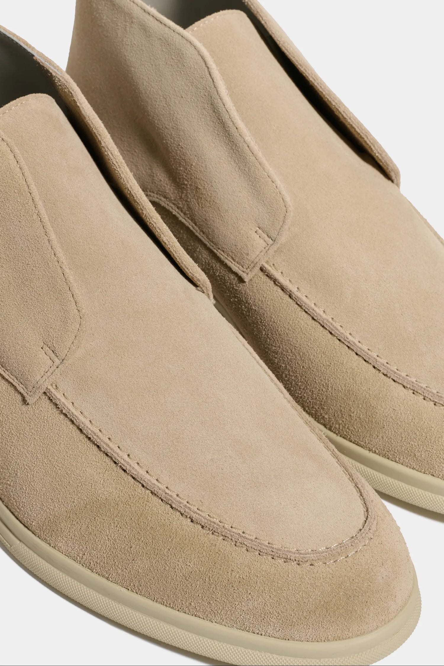 beige polacchino, men suede polacchino, italian suede loafers, beige suede loafers, slip-on suede boot, mid-top suede shoe, made in italy polacchino, luxury suede polacchino, elegant suede footwear, refined italian polacchino, premium suede loafers, soft suede ankle boot, versatile suede shoe, handcrafted italian footwear, timeless polacchino design, comfortable suede loafers, upscale suede shoe, italian craftsmanship polacchino, casual luxury footwear, classic beige suede loafer