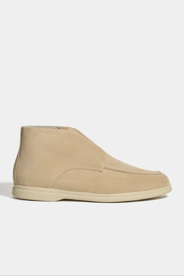 beige polacchino, men suede polacchino, italian suede loafers, beige suede loafers, slip-on suede boot, mid-top suede shoe, made in italy polacchino, luxury suede polacchino, elegant suede footwear, refined italian polacchino, premium suede loafers, soft suede ankle boot, versatile suede shoe, handcrafted italian footwear, timeless polacchino design, comfortable suede loafers, upscale suede shoe, italian craftsmanship polacchino, casual luxury footwear, classic beige suede loafer