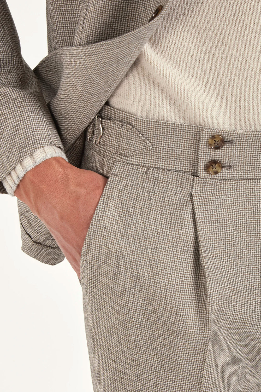 Taupe houndstooth suit, Italian style, made in Italy, tailored luxury suit, elegant menswear suit, refined formalwear, premium Italian craftsmanship, classic houndstooth weave suit, sophisticated business suit, smart formal attire, versatile modern suit, polished two-piece suit, fine Italian tailoring, upscale menswear suit, timeless Italian suit, refined professional look, sharp tailored suit, luxury office suit, contemporary houndstooth blazer, Italian elegance suit
