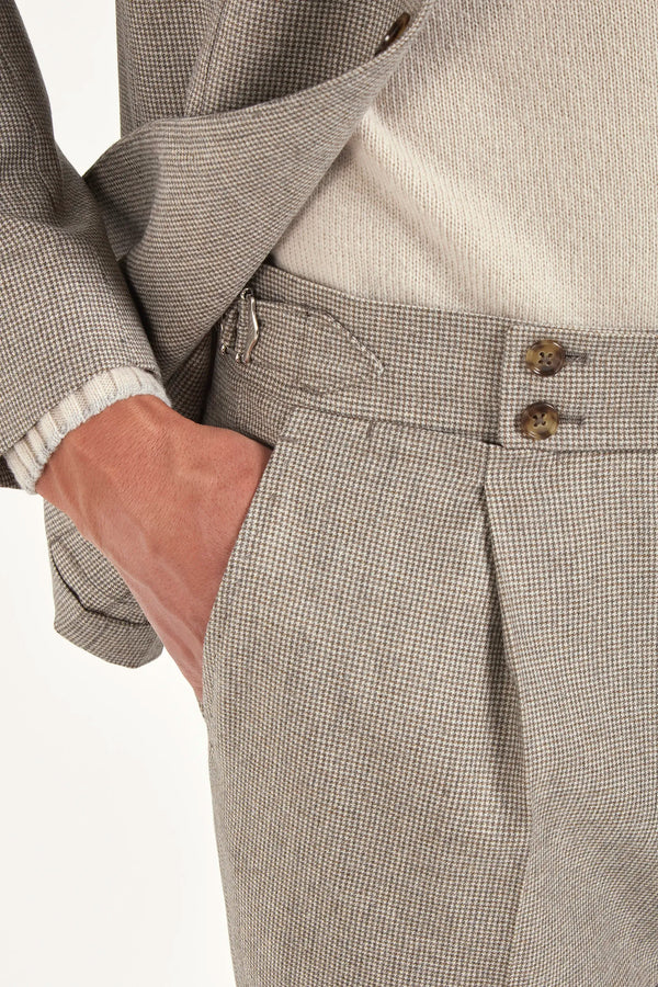 Taupe houndstooth suit, Italian style, made in Italy, tailored luxury suit, elegant menswear suit, refined formalwear, premium Italian craftsmanship, classic houndstooth weave suit, sophisticated business suit, smart formal attire, versatile modern suit, polished two-piece suit, fine Italian tailoring, upscale menswear suit, timeless Italian suit, refined professional look, sharp tailored suit, luxury office suit, contemporary houndstooth blazer, Italian elegance suit