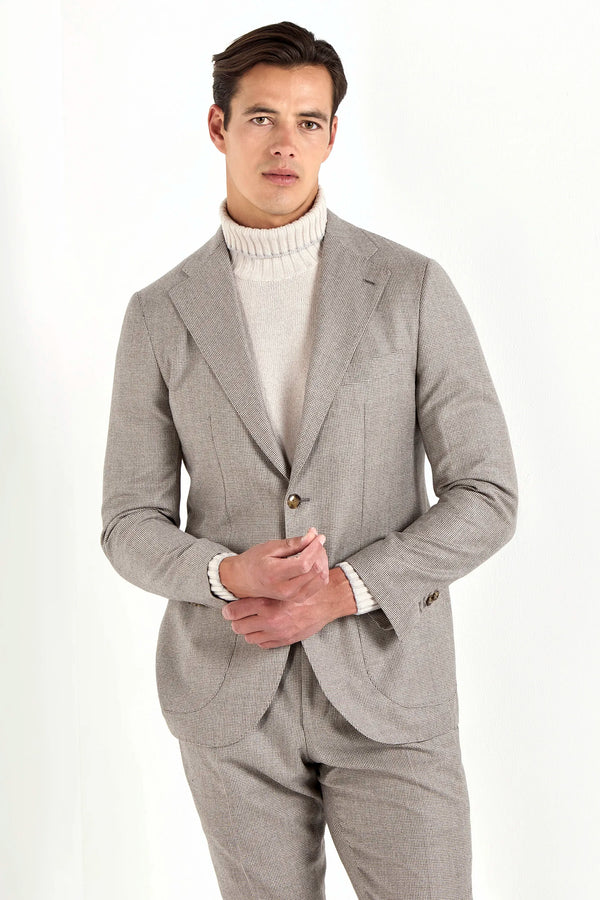 Taupe houndstooth suit, Italian style, made in Italy, tailored luxury suit, elegant menswear suit, refined formalwear, premium Italian craftsmanship, classic houndstooth weave suit, sophisticated business suit, smart formal attire, versatile modern suit, polished two-piece suit, fine Italian tailoring, upscale menswear suit, timeless Italian suit, refined professional look, sharp tailored suit, luxury office suit, contemporary houndstooth blazer, Italian elegance suit