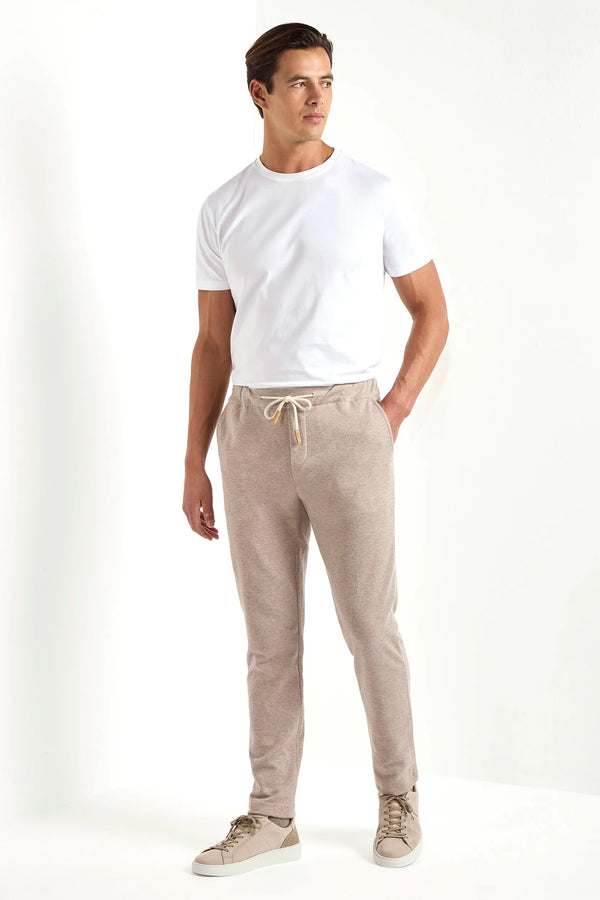 taupe jersey jogger pants, men jersey jogger pants, italian jersey jogger pants, taupe wool jogger pants, luxury men's jersey jogger pants, elegant men's jogger pants, refined jersey jogger pants, tailored taupe jogger pants, premium italian jogger pants, sophisticated men's jersey jogger pants, timeless italian jogger pants, upscale men's jersey jogger pants, classic taupe jersey jogger pants, italian craftsmanship jogger pants, premium men's taupe joggers, refined italian wool jogger pants