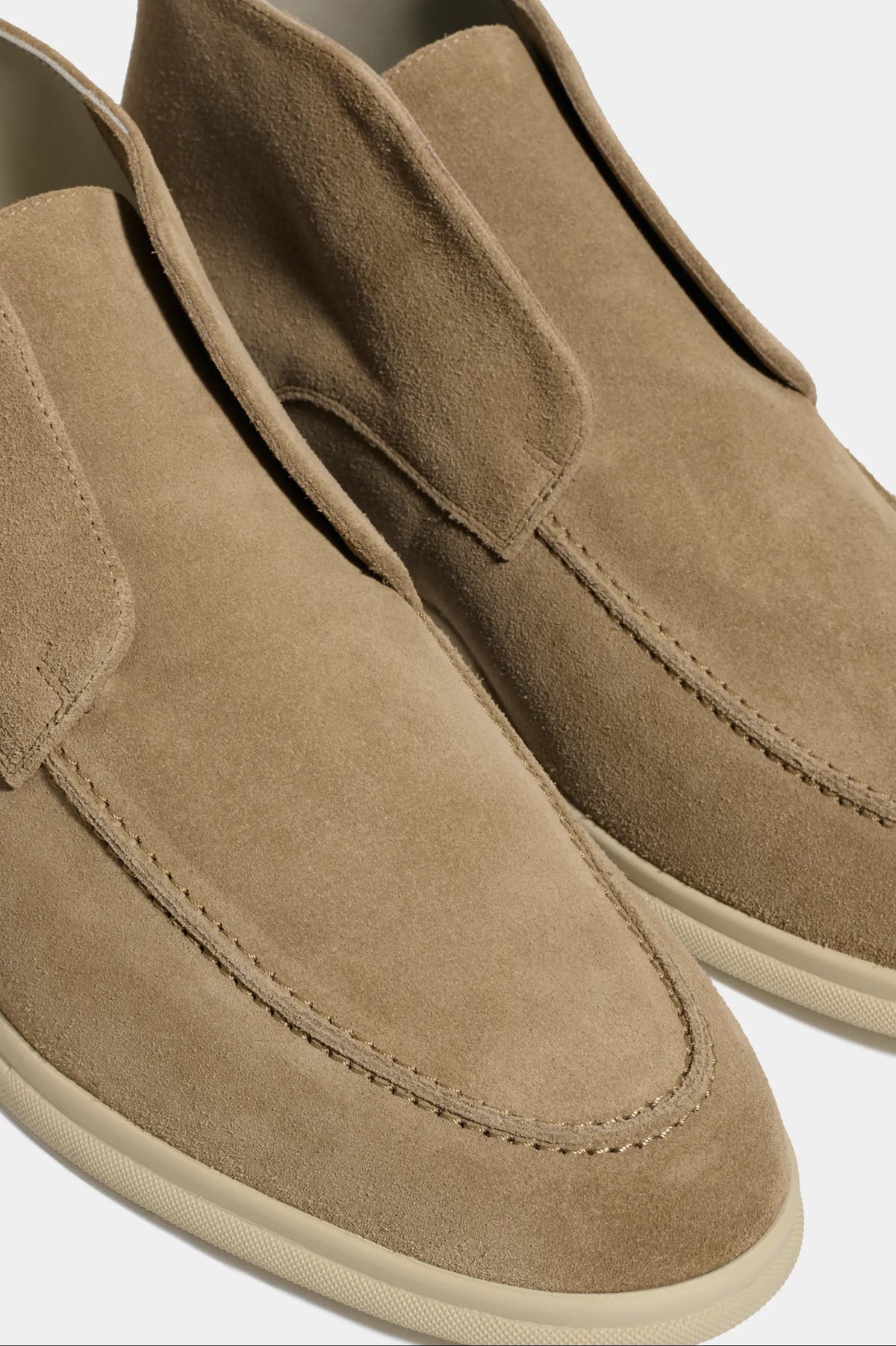 taupe polacchino, men suede polacchino, italian suede loafers, taupe suede loafers, slip-on suede boot, mid-top suede shoe, made in italy polacchino, luxury suede polacchino, elegant suede footwear, refined italian polacchino, premium suede loafers, soft suede ankle boot, versatile suede shoe, handcrafted italian footwear, timeless polacchino design, comfortable suede loafers, upscale suede shoe, italian craftsmanship polacchino, casual luxury footwear, classic taupe suede loafer
