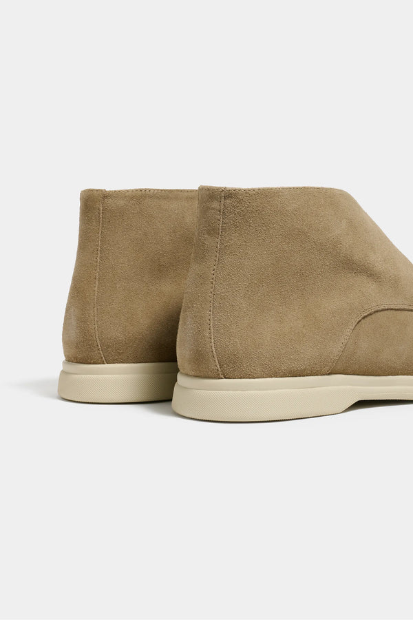 taupe polacchino, men suede polacchino, italian suede loafers, taupe suede loafers, slip-on suede boot, mid-top suede shoe, made in italy polacchino, luxury suede polacchino, elegant suede footwear, refined italian polacchino, premium suede loafers, soft suede ankle boot, versatile suede shoe, handcrafted italian footwear, timeless polacchino design, comfortable suede loafers, upscale suede shoe, italian craftsmanship polacchino, casual luxury footwear, classic taupe suede loafer