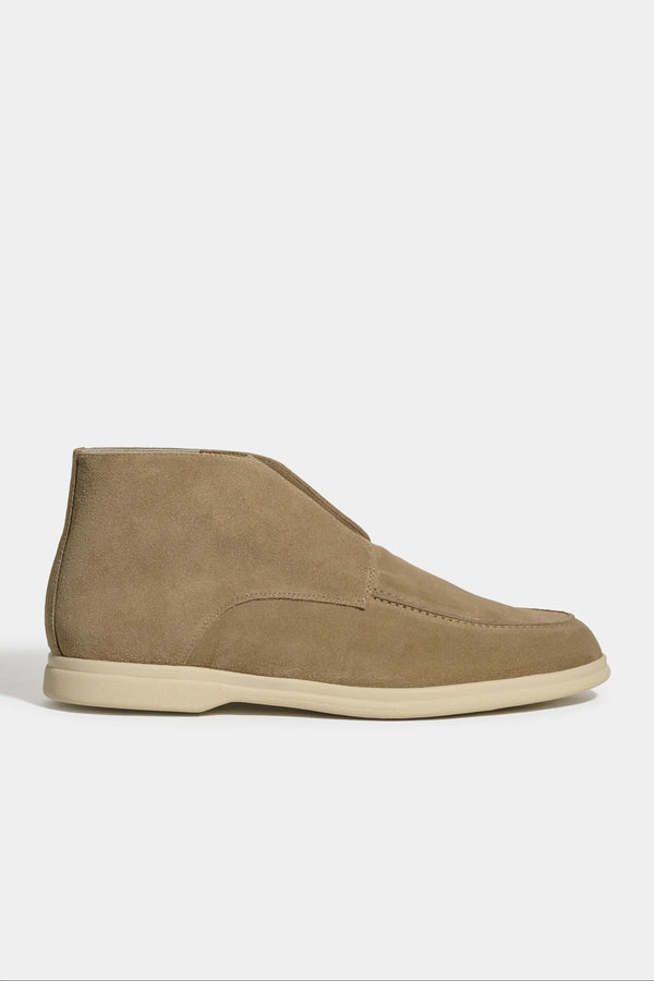 taupe polacchino, men suede polacchino, italian suede loafers, taupe suede loafers, slip-on suede boot, mid-top suede shoe, made in italy polacchino, luxury suede polacchino, elegant suede footwear, refined italian polacchino, premium suede loafers, soft suede ankle boot, versatile suede shoe, handcrafted italian footwear, timeless polacchino design, comfortable suede loafers, upscale suede shoe, italian craftsmanship polacchino, casual luxury footwear, classic taupe suede loafer